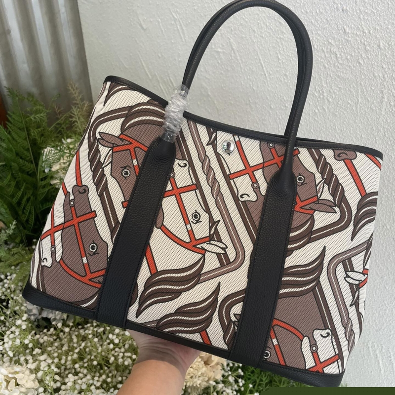 H**mes shopping bags